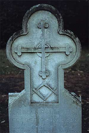 headstone with masonic symbol